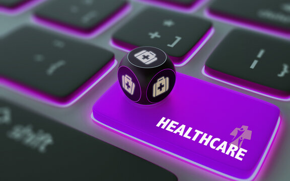 First Aid Kit Symbol On A Dice Over Laptop Computer Keyboard with Healthcare Text on Enter Button