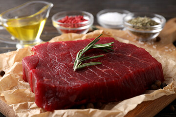 Concept of cooking with raw steak, close up