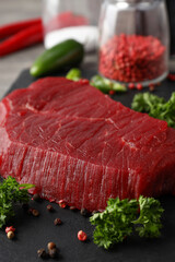 Concept of cooking with raw steak, close up