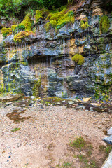 Natural ground water weeping through a sandstone wall