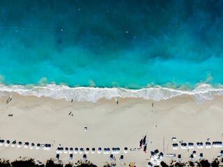 Aerial image of Grace Bay Beach, Turks and Caicos Islands with half sand and half water