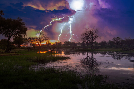 Botswana, Okavango Delta, Thunderstorm over swamp