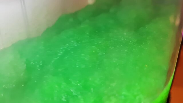 Close up of spinning machine for frozen fruit drinks like slushies.