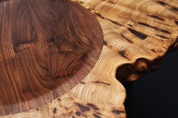Style wooden countertop slab, saw cut wood treated with varnish close-up on black. Isolate.