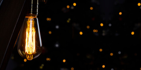 Bulb. Edison's light bulb. Desk lamp. Against a dark background. Black