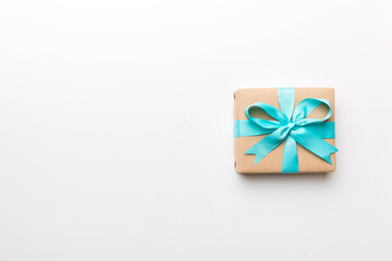 Holiday present box over colored background, top view. Copy space for design