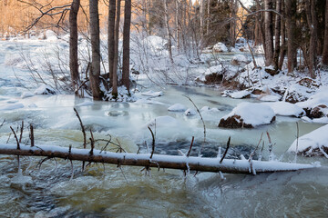 Fototapeta na wymiar Winter freezing river in cold winter weather