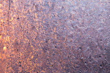 Winter frost on the window glass, ice purple pattern