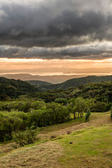 Foothills of Monteverde.  Panoramic view in beautiful orange sunset. Santa Elena in Costa Rica highlands.