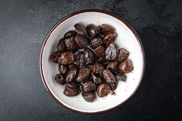 sun-dried olives smoked pitted olive fruit healthy meal food snack on the table copy space food background rustic top view keto or paleo diet veggie vegan or vegetarian food