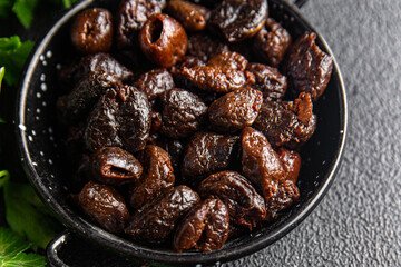 sun-dried olives smoked pitted olive fruit healthy meal food snack on the table copy space food background rustic top view keto or paleo diet veggie vegan or vegetarian food