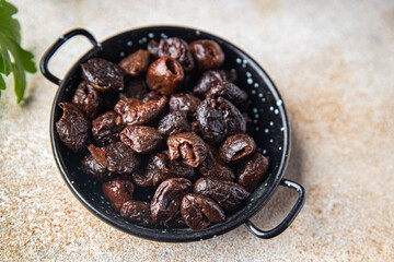 sun-dried olives smoked pitted olive fruit healthy meal food snack on the table copy space food background rustic top view keto or paleo diet veggie vegan or vegetarian food