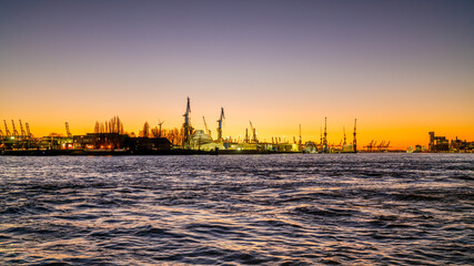 Fototapeta premium Hamburg, Germany. The harbor at sundown.