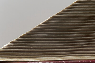 Macro photo of pages of an old book on a white background