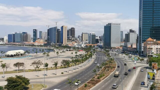 Aerial drone footage of downtown Luanda, bay, Port of Luanda, marginal with residential and office buildings, metropolitan and business area of Luanda, in Angola