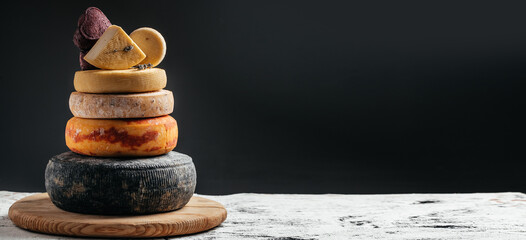 storage of cheese products. Various kind of cheese, traditional pieces of french and italy hand-made cheese. Long banner format