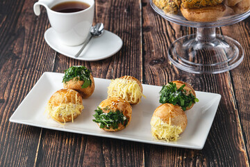 Turkish pastry filled with dill, parsley, cream cheese and cheddar cheese. Turkish name: Sakallı...