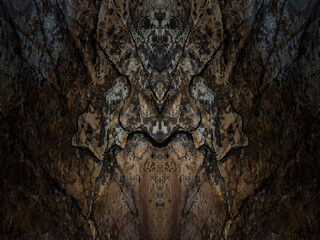 Alien Heads Sculpted in a Granite Rock, Symmetrical Kaleidoscope Mirror, Abstract Background.