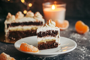 Christmas cake. Delicious cake with winter decor. Cake with tangerines on the table 