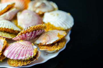 Mini coquilles St. Jacques, Natural scallop shells filled with Patagonian scallops and Thermidor sauce topped with a ciabatta breadcrumb topping