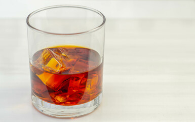 Excellent whisky served with ice cubes in a glass of Old fashioned type
