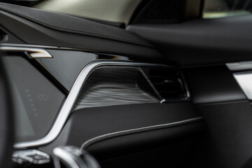 Obraz na płótnie Canvas Modern car interior close up view with metallic and plastic details. Interior detail.