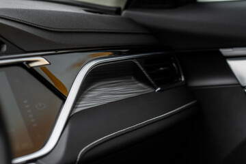 Fototapeta na wymiar Modern car interior close up view with metallic and plastic details. Interior detail.