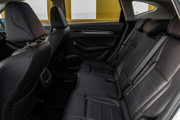 Modern SUV car inside. Leather black back passenger seats in modern luxury car. Comfortable leather seats.