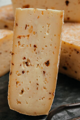 dried tomatoes cheese and mold. handicraft production. hard cheese delicious dairy products. Food recipe background. Close up