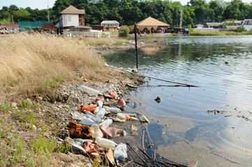 The lake and the shore are littered with garbage