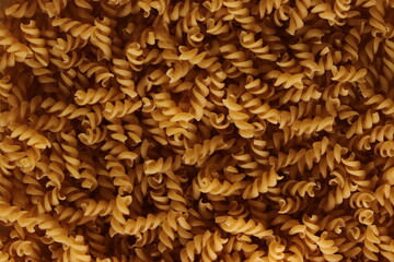 background of spread fusilli pasta