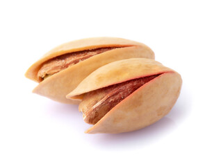 Two pistachios isolated on a white background