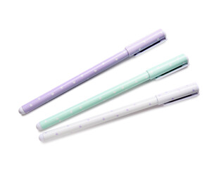 Colorful pens on white background