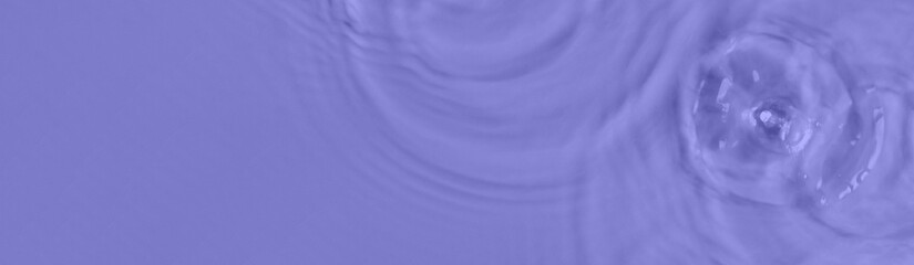 Purple water surface color background with ripples, circles and drops