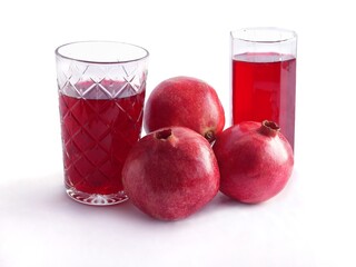 red,juicy pomegranats as vegetarian food and drink