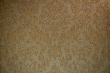 Gold color background with flower patterns