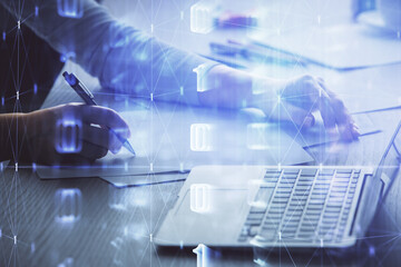 Multi exposure of woman hands working on computer and data theme hologram drawing. Tech concept.