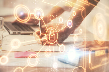 Double exposure of woman hands typing on computer and social network theme hologram drawing. People media concept.