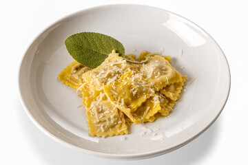 Ravioli pasta with butter and sage sauce with grated parmesan and sage leaf in white plate isolated on white, clipping path