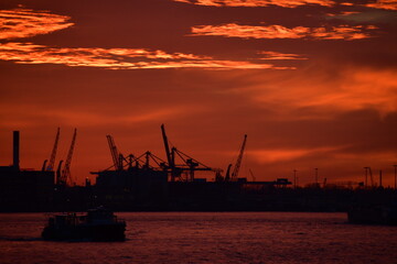 Fototapeta na wymiar Striking red sunset over Rotterdam, Netherlands