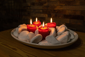 Advent wreath with four red candles candles mark the celebration of Christmas.