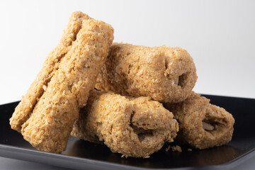 Indian traditional sweets for Makar Sankranti Or Lohri Mithai Gajak Also Known As Gur Gajjak, Gazak, Gachak Til Patti Or Papdi, Chikki Is Made Of Jaggery Gud, Almonds Badam And Pistachio