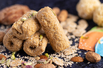 Winter delicacy Indian traditional sweet mithai with kites for Makar Sankranti Lohri Gajak Also Known As Gur Gajjak Gazak Gachak Made Of Jaggery Gud Almonds Badam And Pistachio