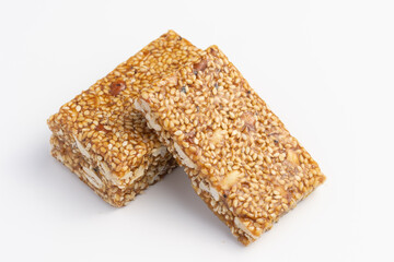 Indian sweets Mithai Gajjak Made Of til sesame seed Jaggery Gud Almonds Badam And Pistachio Also Known As til patti Gur Gajjak Gazak Gachak prepared during for Makar Sankranti Lohri