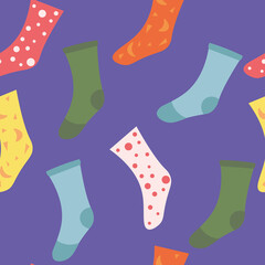 Seamless vector pattern with multicolored socks on a purple background