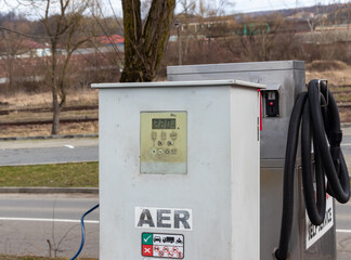 Close-up photo showing a tire air pumping station, inflating wheels on cars
