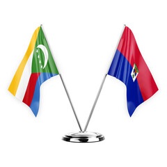 Two table flags isolated on white background 3d illustration, comoros and haiti