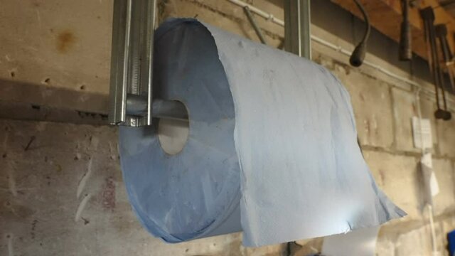 A roll of toilet paper on the wall inside the auto shop in Estonia