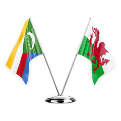 Two table flags isolated on white background 3d illustration, comoros and wales