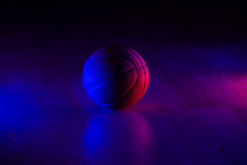 Basketball ball isolated on dark background. Blue neon banner. Horizontal sport theme poster, greeting cards, headers, website and app